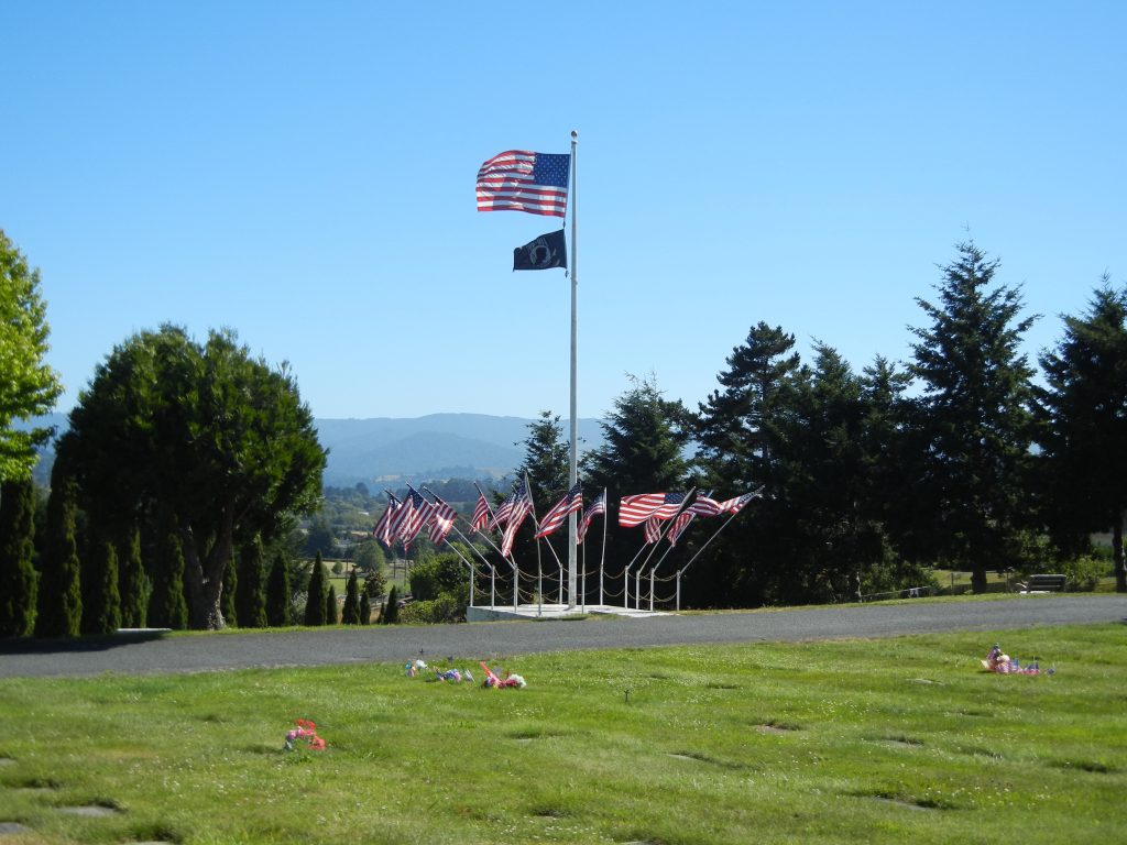 Image of flags flying at Sunrise Cemetery